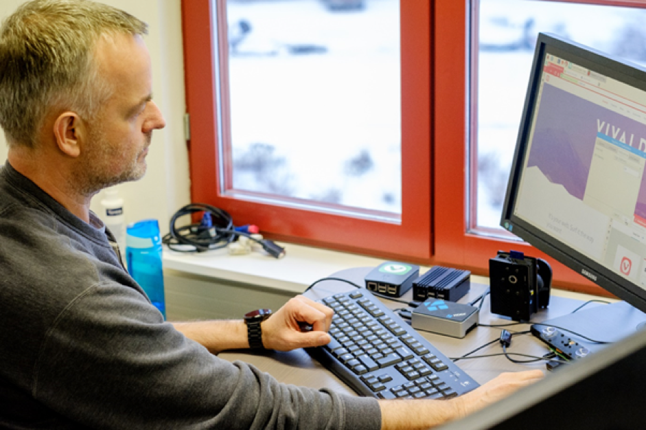 Developer working with Raspberry Pi at his desk.