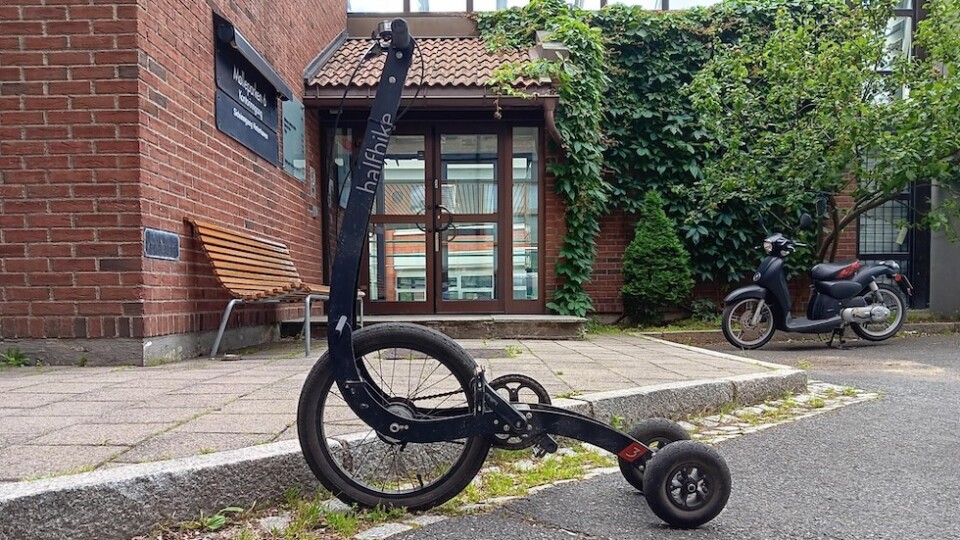 A HalfBike in front of a brick building