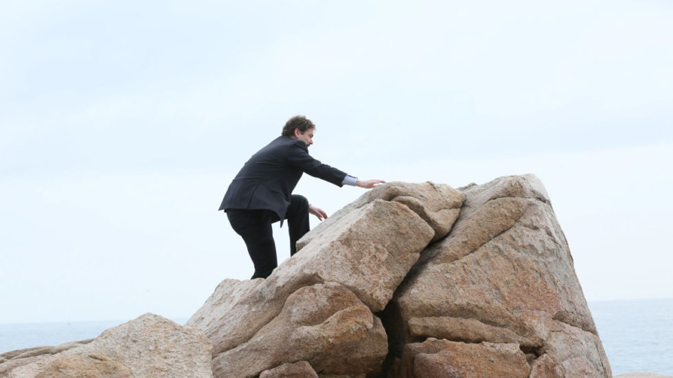 Jon von Tetzchner climbs a mountain.