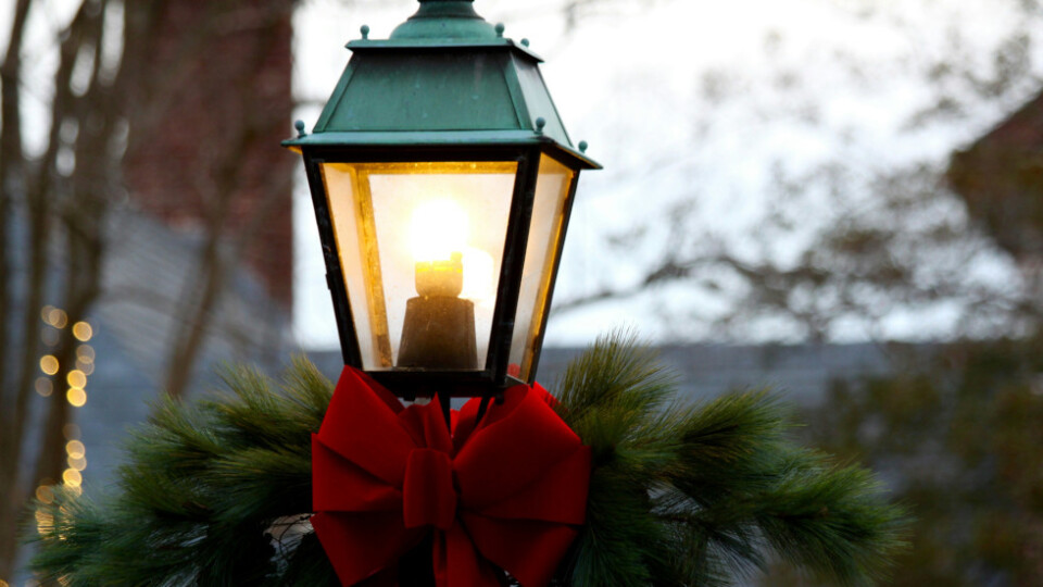 A lamp tied with a red bow