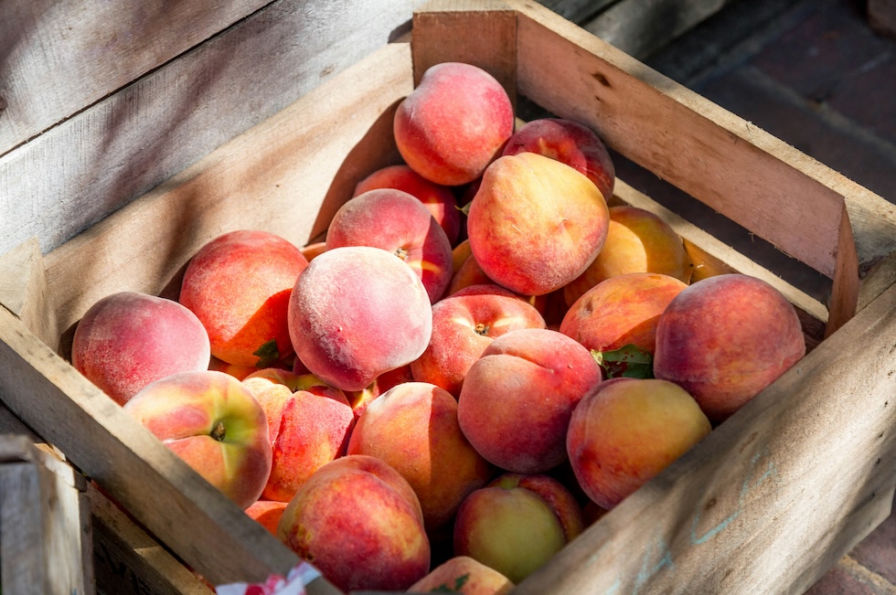 Peaches in a wooden crate