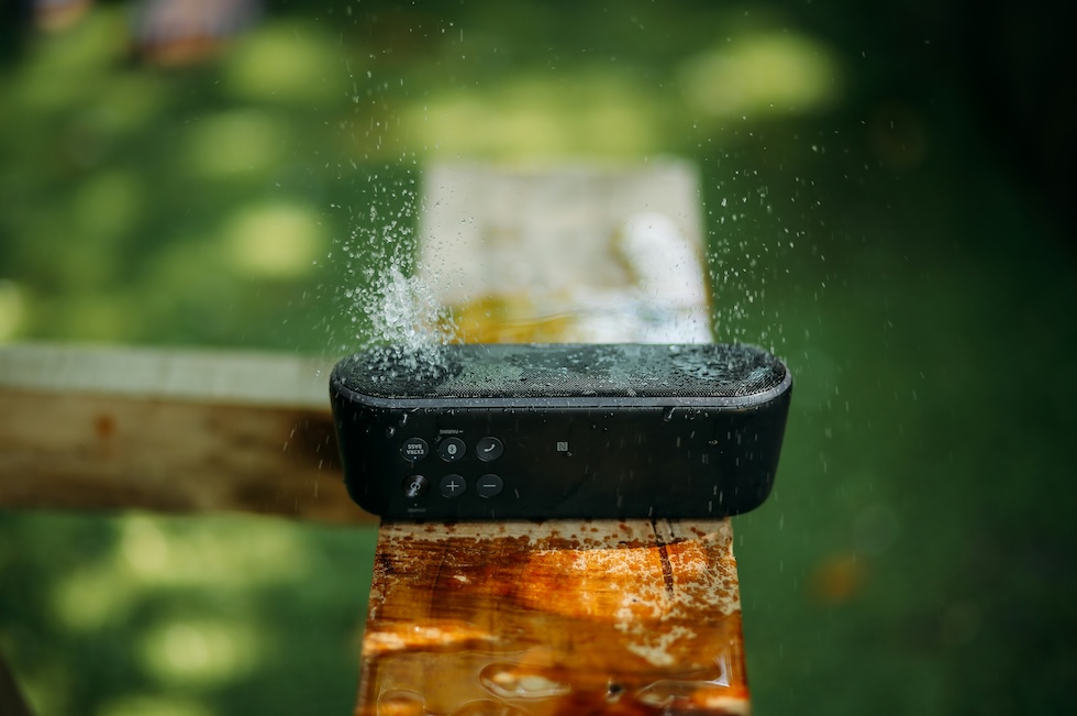 Speakers with water bouncing off them